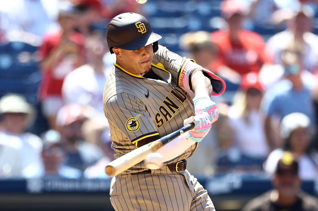 Manny Machado #13 of the San Diego Padres hits a single during the sixth inning against the Philadelphia Phillies  at Citizens Bank Park on June 19, 2024 in Philadelphia, Pennsylvania. 