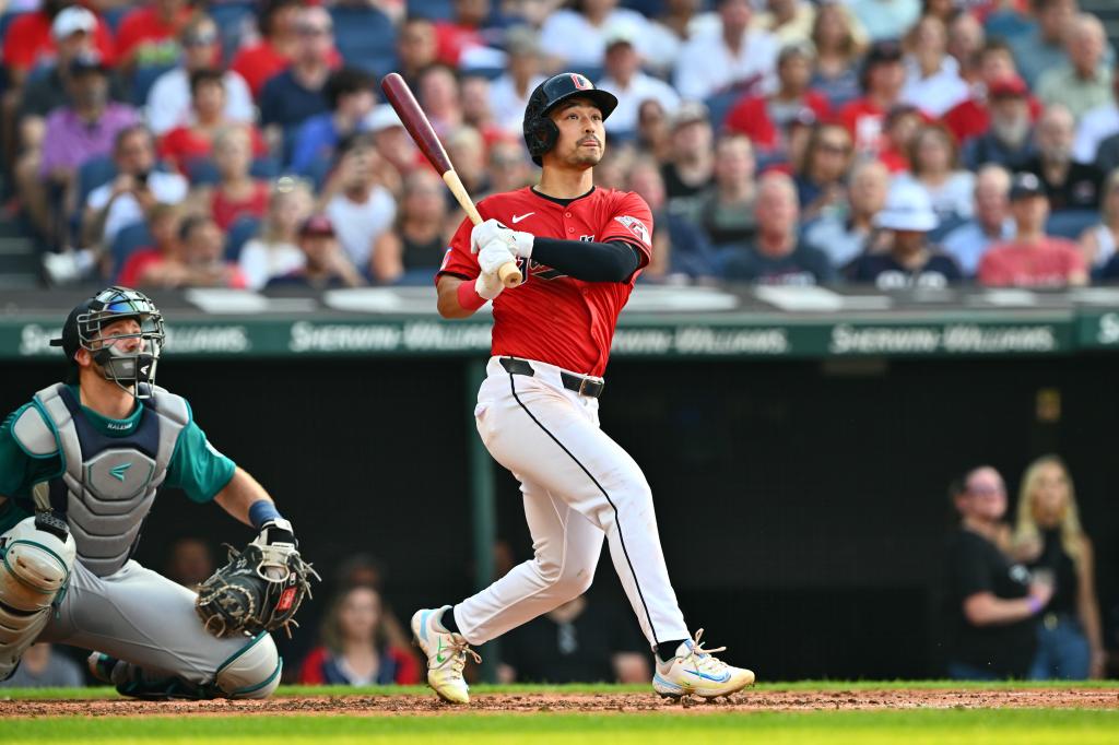 Steven Kwan #38 of the Cleveland Guardians watches a two-run homer during the second inning against the Seattle Mariners at Progressive Field on June 19, 2024, in Cleveland, Ohio. 