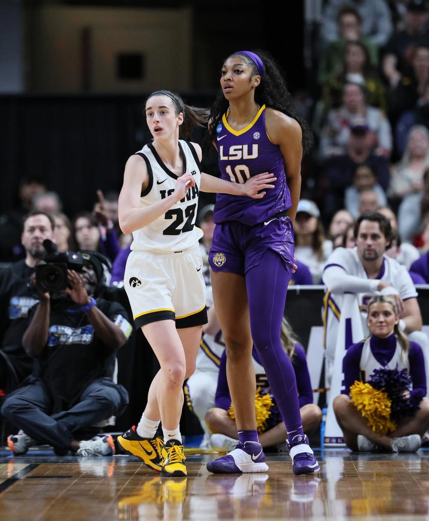 Caitlin Clark of the Iowa Hawkeyes and Angel Reese of the LSU Tigers playing in the finals of the NCAA Women's Basketball Tournament at MVP Arena, Albany