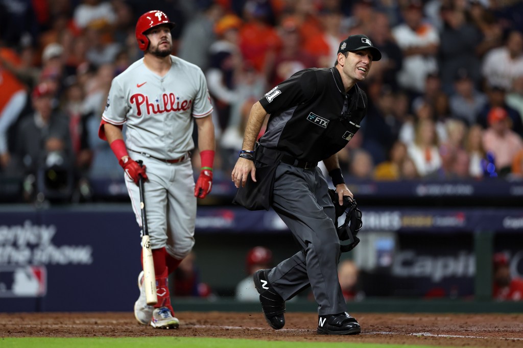 Umpire Pat Hoberg #31 watches the ball hit by Kyle Schwarber #12 of the Philadelphia Phillies in the eighth inning against the Houston Astros in Game Two of the 2022 World Series at Minute Maid Park on October 29, 2022 in Houston, Texas.