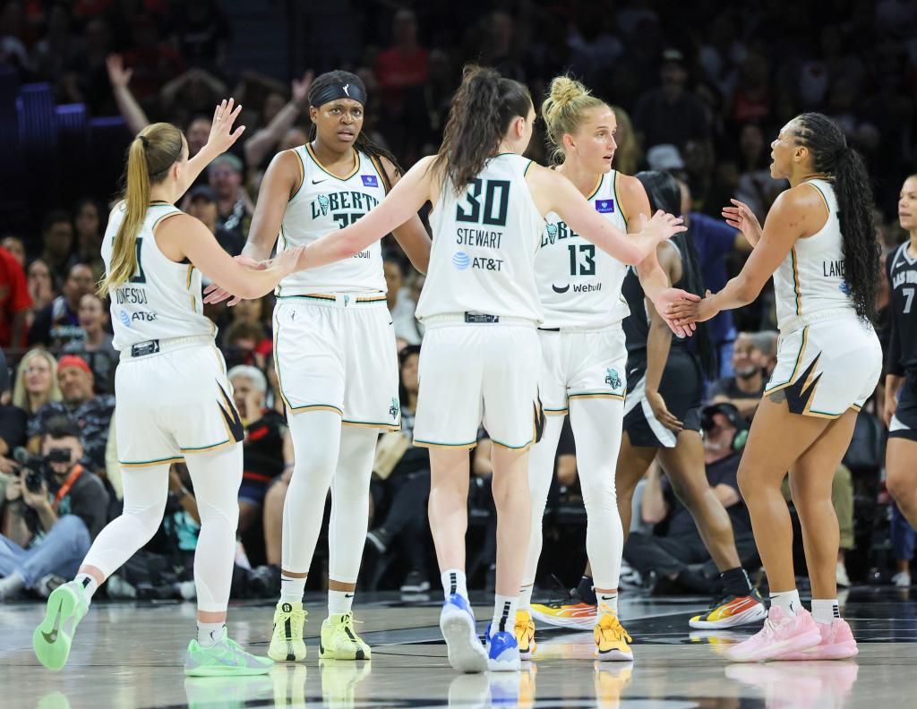 Sabrina Ionescu #20, Jonquel Jones #35, Breanna Stewart #30, Leonie Fiebich #13 and Betnijah Laney-Hamilton #44 of the New York Liberty huddle on the court 