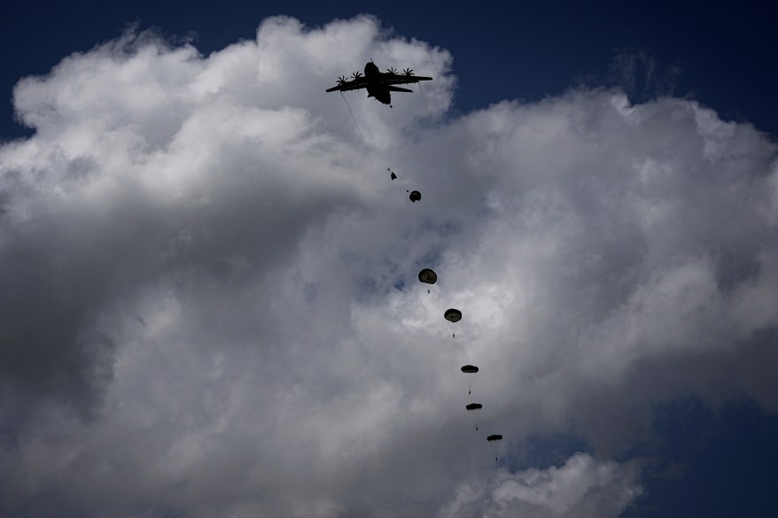 400 British, Belgian, Canadian and US paratroopers take part in a parachute drop to commemorate the contribution of airborne forces on D-Day. as part of the 80th anniversary of D-Day, in Sannerville, Normandy, France, Wednesday, June 5, 2024.
