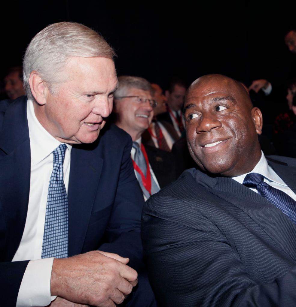 Jerry West and Magic Johnson, two Los Angeles Lakers greats, having a discussion at the Los Angeles Convention Center in 2011