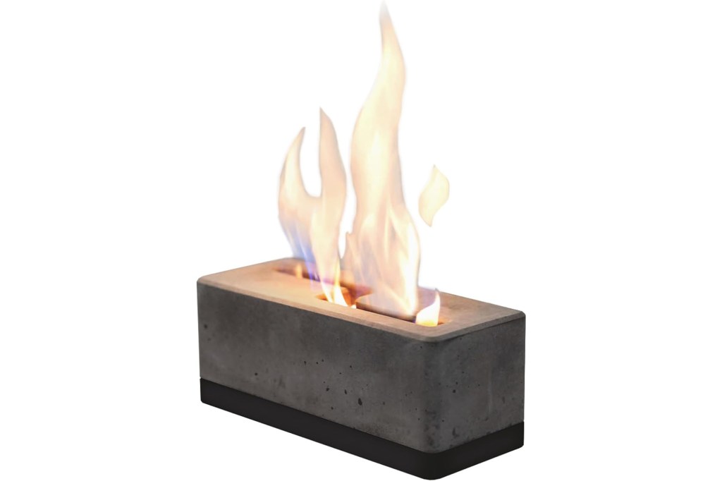 A fire burning in a rectangular concrete container