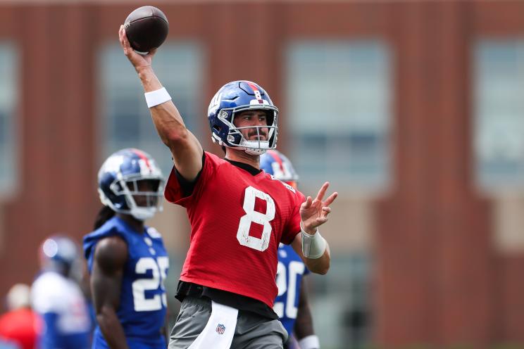 Daniel Jones, #8 of the New York Giants, throwing a football during OTA Offseason Workouts in East Rutherford, New Jersey