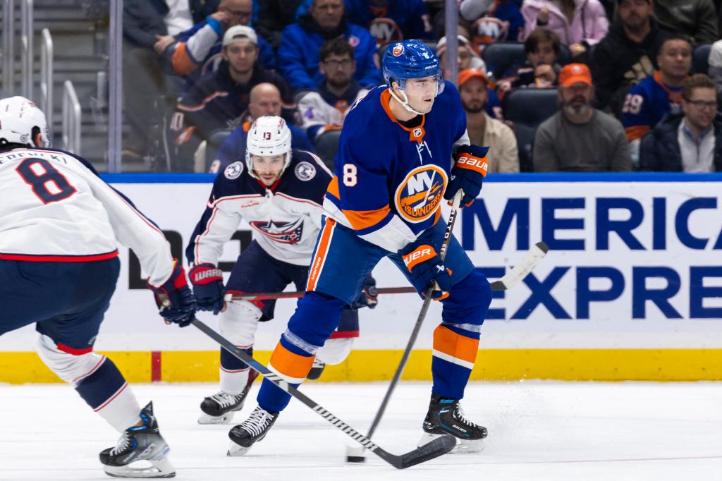 Noah Dobson #8 of the New York Islanders looks to pass the puck in the first period, Thursday, Dec. 7.