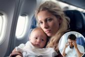 Woman holding baby on plane