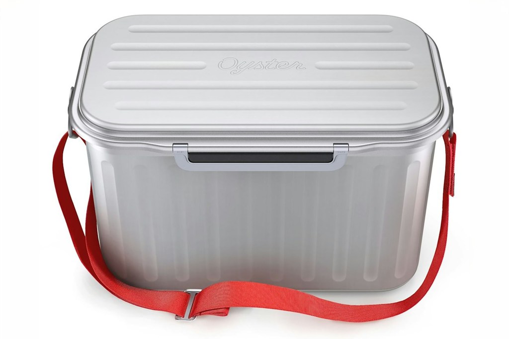 Silver cooler with a red strap