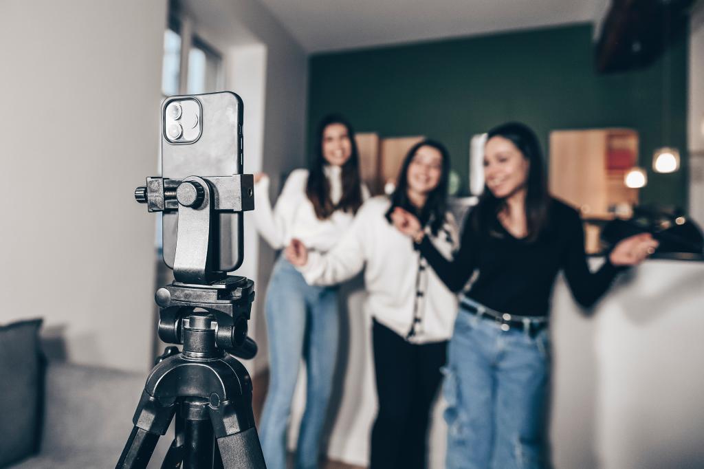 Teens making a dance video in front of a camera