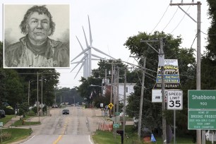 A street with a windmill and a man on it