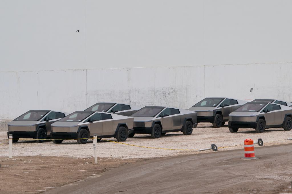 Newly manufactured Tesla Cybertrucks parked outside the company's Texas factory on December 13, 2023.