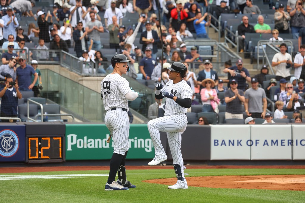 Juan Soto celebrates with Aaron Judge after he scores on his solo home run during the first inning against the White Sox.