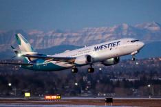 A westJet airplane takes off in Calgaryi