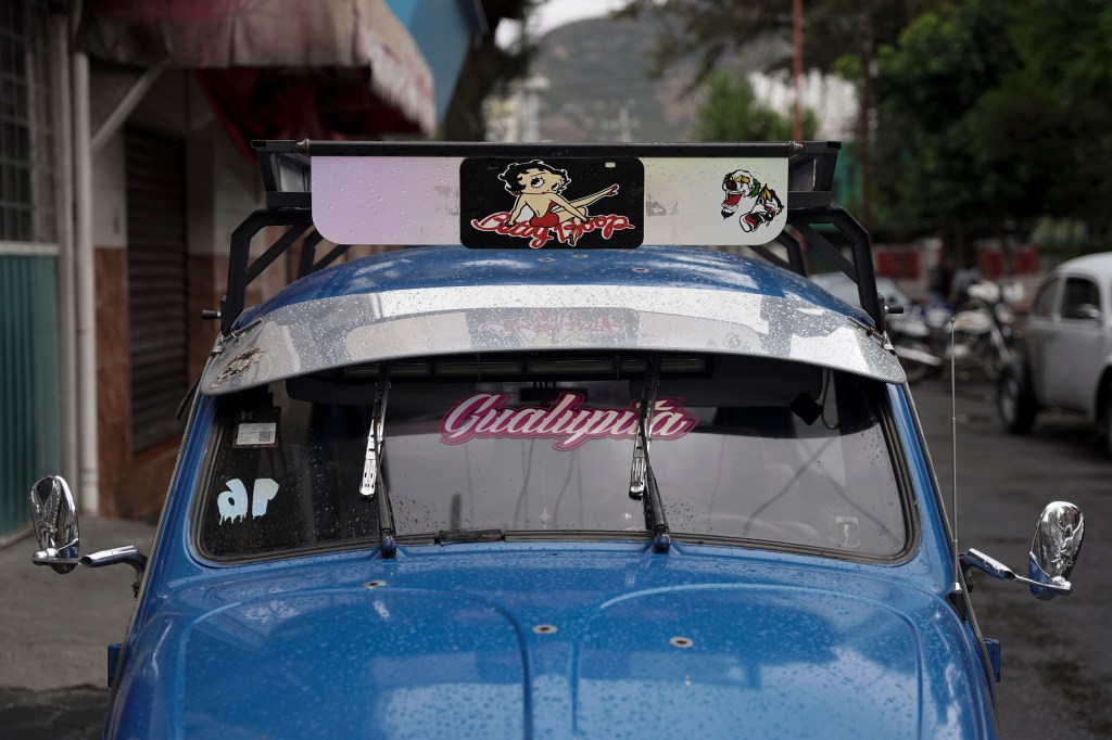 The bright blue Volkswagen Beetle owned by taxi driver Claudio Garcia that he named "Gualupita" after his wife