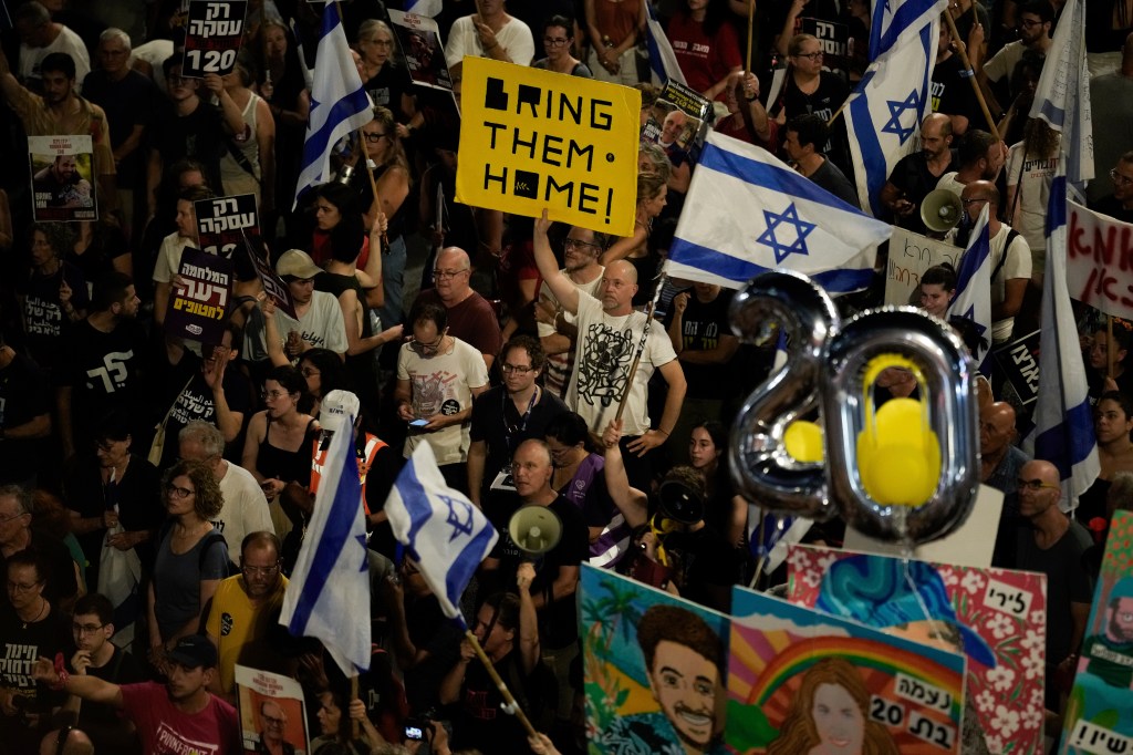 Group of people protesting against Israeli Prime Minister Benjamin Netanyahu's government and demanding hostage release in Tel Aviv, Israel