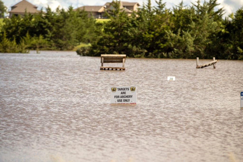 A sign indicating the closure of an archery range due to flooding caused by heavy rainfall, taken on June 22, 2024, in Lincoln County, South Dakota.