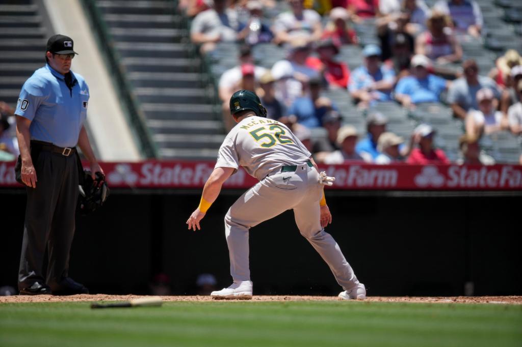 Oakland Athletics' Kyle McCann (52) looks back after missing home plate during the second inning of a baseball game against the Los Angeles Angels in Anaheim, Calif., Wednesday, June 26, 2024.