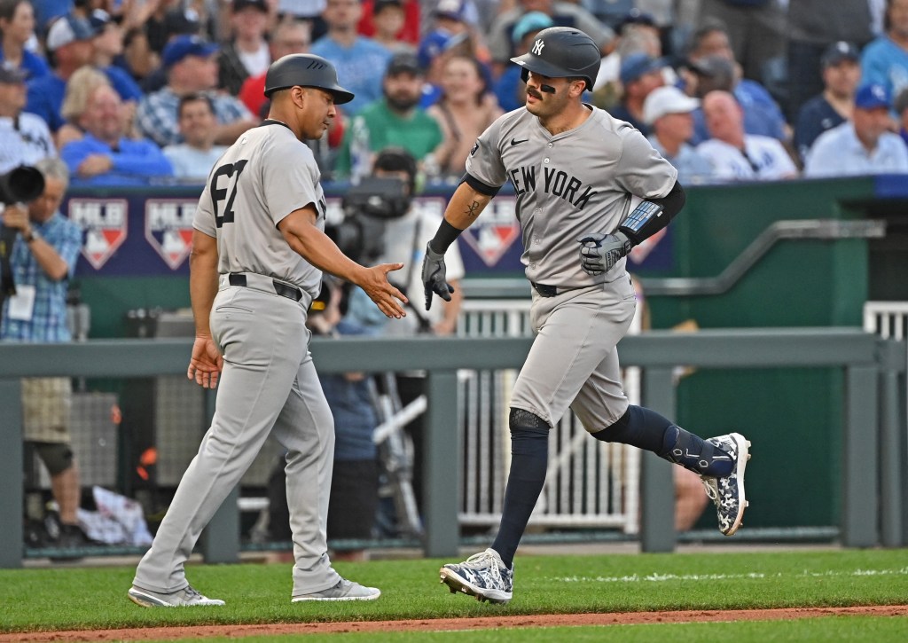 Austin Wells gets congratulations from third base coach Luis Rojas after belting a three-run homer in the fourth inning of the Yankees' win.