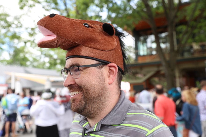 Daniel Angstadt wears a horse-themed hat at Belmont Stakes. 