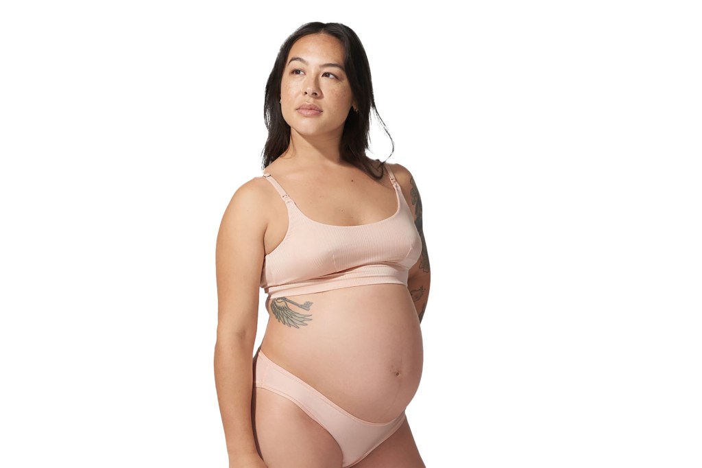 A pregnant woman in underwear showing off Bodily Everything-Bra