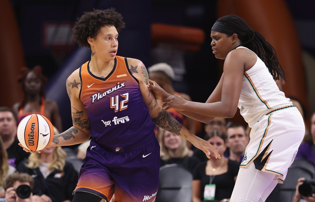 Brittney Griner, who scored 19 points, looks to make a move on Jonquel Jones during the Liberty's 99-93 loss to the Mercury.
