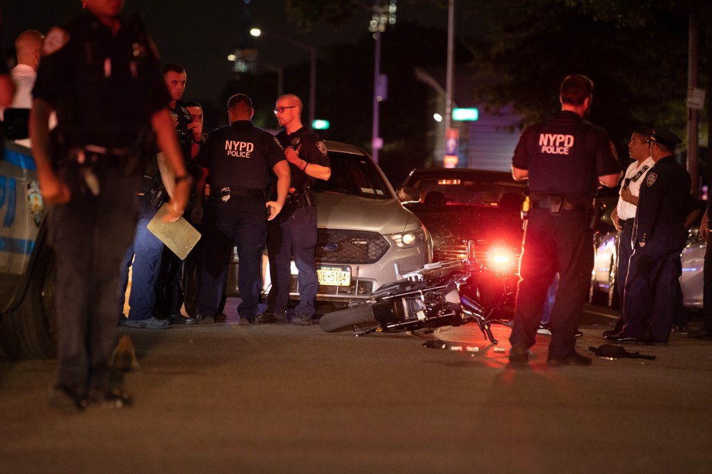 Two cops were shot in Queens Monday morning by a suspect riding on a moped.