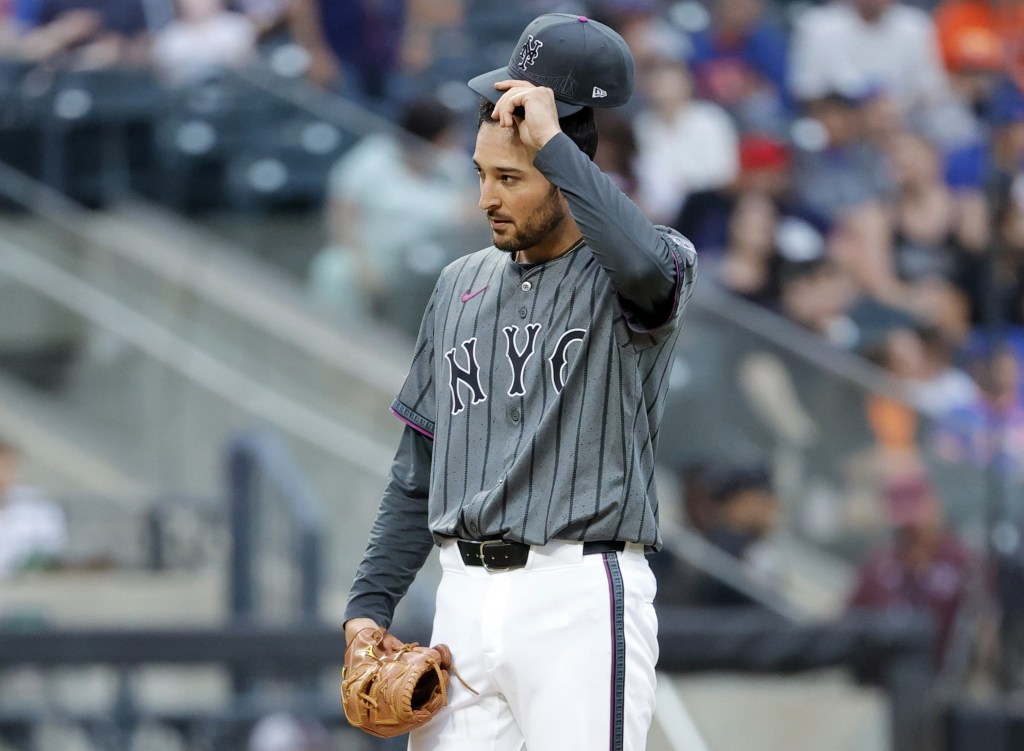 Danny Young reacts dejectedly during the ninth inning in which he gave up two runs during the Mets' loss.