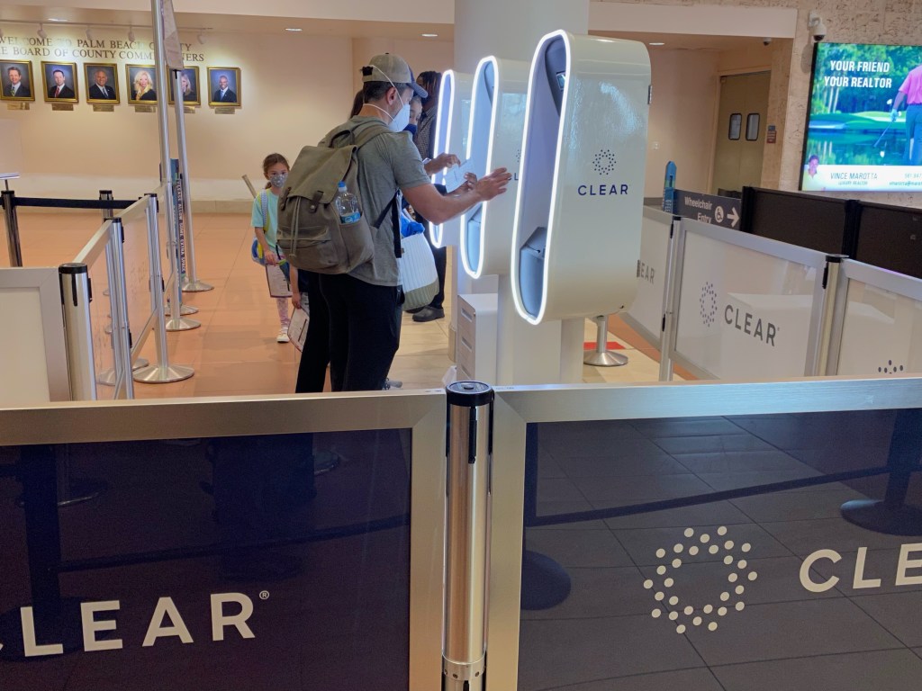 Passengers using CLEAR identity confirmation kiosk at West Palm Beach Airport, Florida