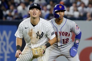 Anthony Volpe #11 of the New York Yankees in action against Francisco Lindor #12 of the New York Mets at Yankee Stadium on July 25, 2023 in Bronx borough of New York City. The Mets defeated the Yankees 9-3.