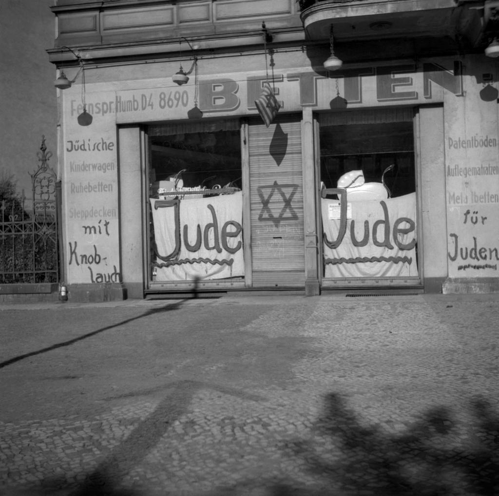 A picture taken in Berlin shows a Jewish-run shop inscripted with nazi antisemitic graffitis during the June 1938 antisemitic campaign