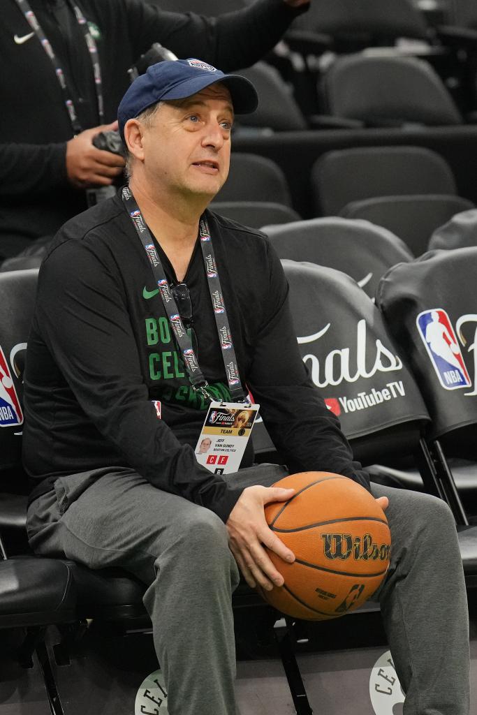 Jeff Van Gundy holding a basketball during the 2024 NBA Finals practice at the TD Garden in Boston, Massachusetts