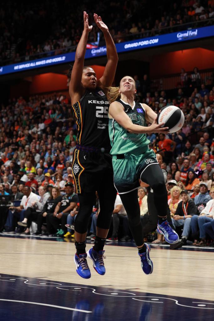 Sabrina Ionescu #20 of the New York Liberty drives to the basket during the game against the Connecticut Sun