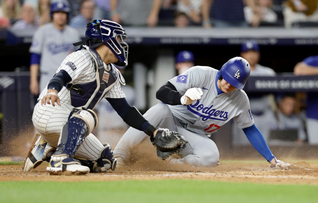 Shohei Ohtani tries to score a run against Jose Trevino at Yankee Stadium on June 9, 2024 in New York City. 