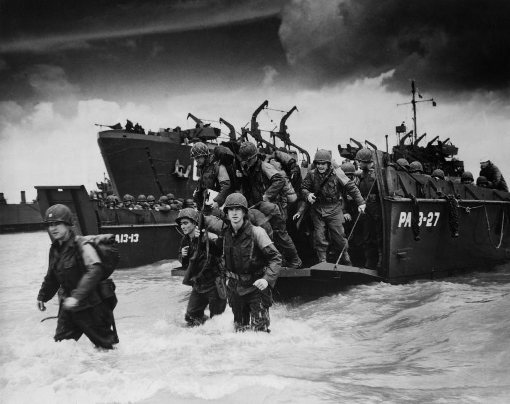Reinforcements disembarking from a landing barge at Normandy during the Allied Invasion of France on D-Day. 
