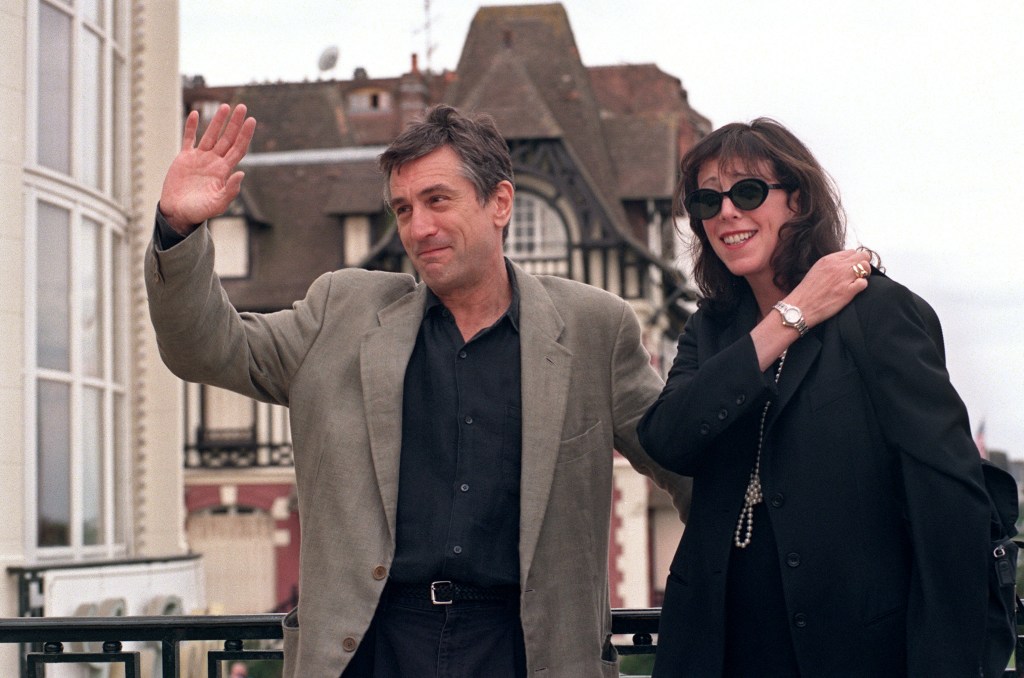 Robert De Niro and Jane Rosenthal waving to photographers at the Deauville Film Festival, 1995