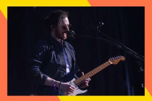 Hozier sings while rocking out on guitar.