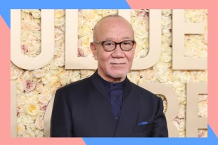 Joe Hisaishi poses on the red carpet.