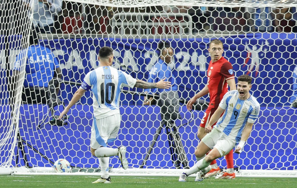 Julián Álvarez (right) celebrates after scoring a goal with the help of a through ball from Lionel Messi (left) during Argentina's 2-0 win over Canada in their Copa American opener.