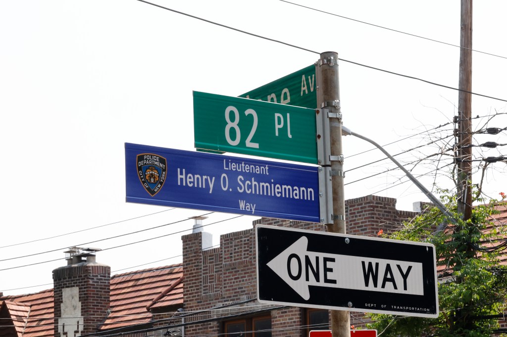 The new street sign at Penelope Ave and 82 Place unveiled during the Street naming ceremony honoring Lt. Henry Schmiemann.