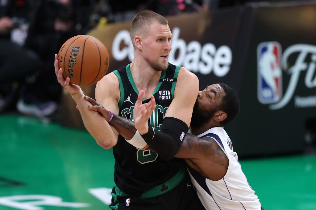 Kristaps Porzings looks to make a move on Kyrie Irving during the Celtics' Game 2 victory.