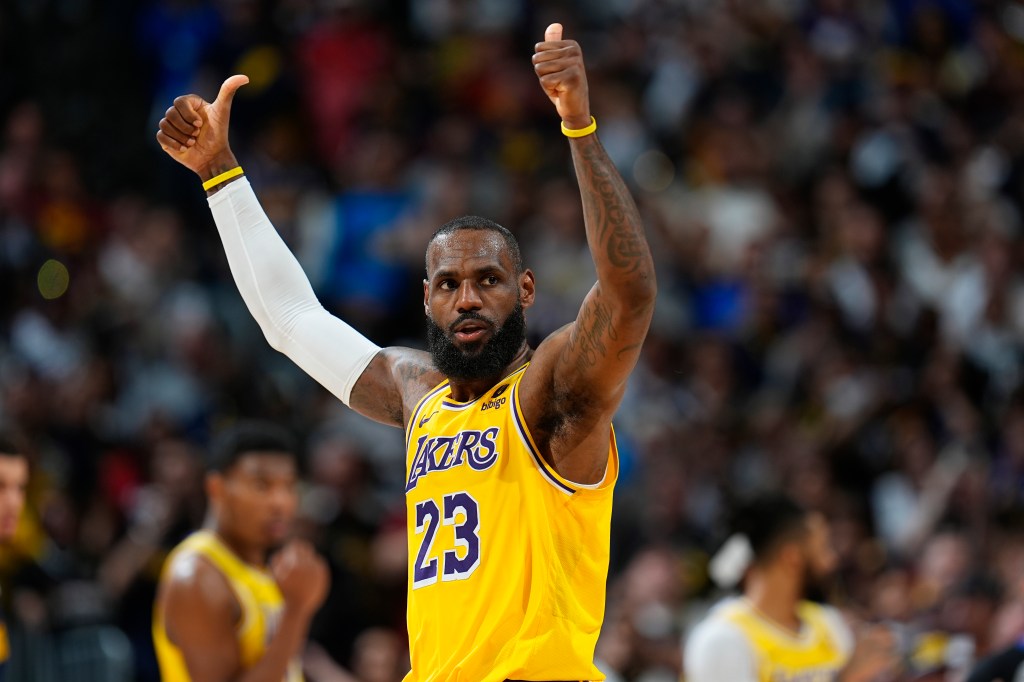 LeBron James gesturing for a call during a Lakers vs Nuggets NBA playoff game