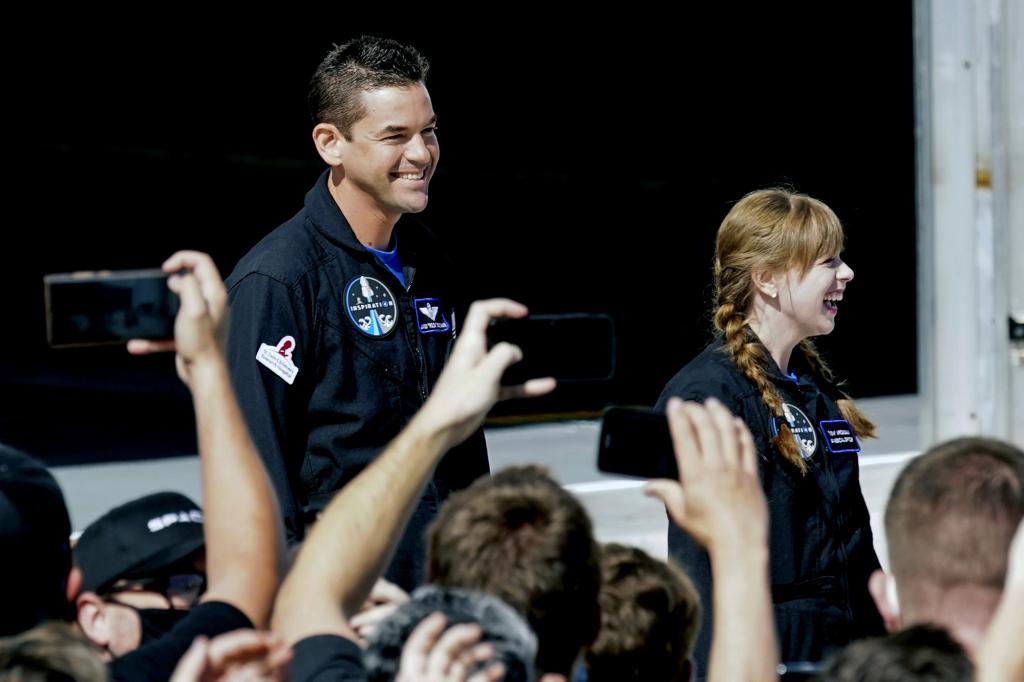 Jared Issacman and Haley Arceneaux prepare to head to launchpad 39A for a launch on a SpaceX Falcon 9