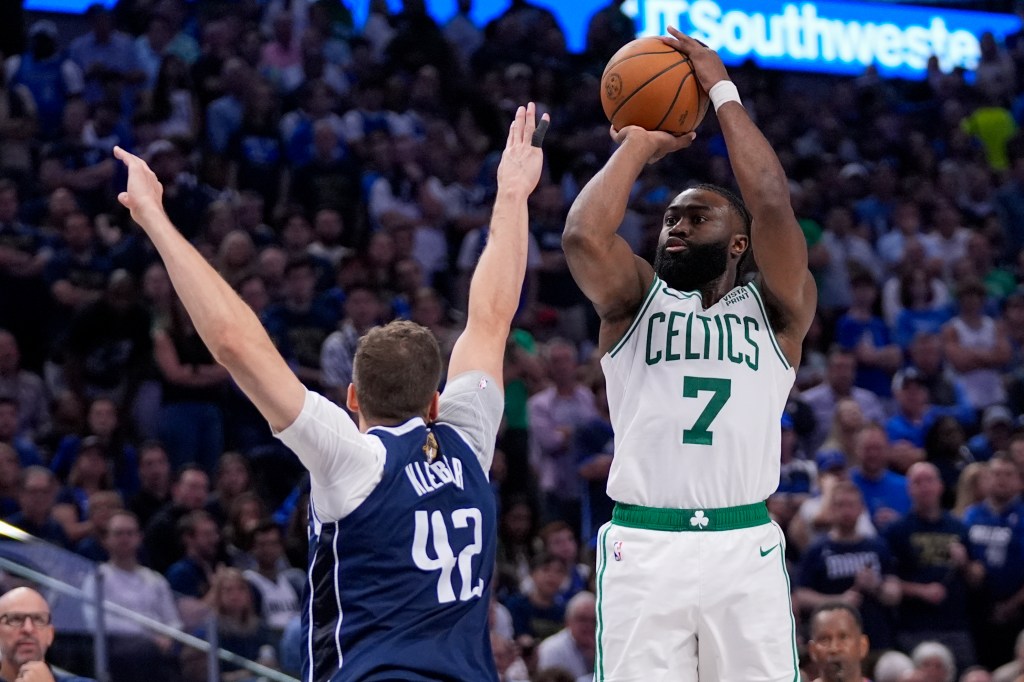 Boston Celtics guard Jaylen Brown shooting against Dallas Mavericks forward Maxi Kleber in Game 3 of the NBA finals, June 12, 2024.