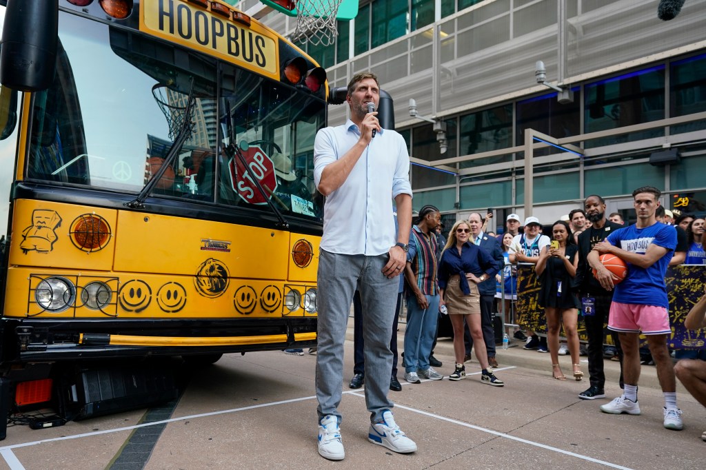 Former Dallas Mavericks player Dirk Nowitzki addressing supporters with a microphone prior to Game 3 of the NBA basketball finals between the Mavericks and the Boston Celtics in Dallas.