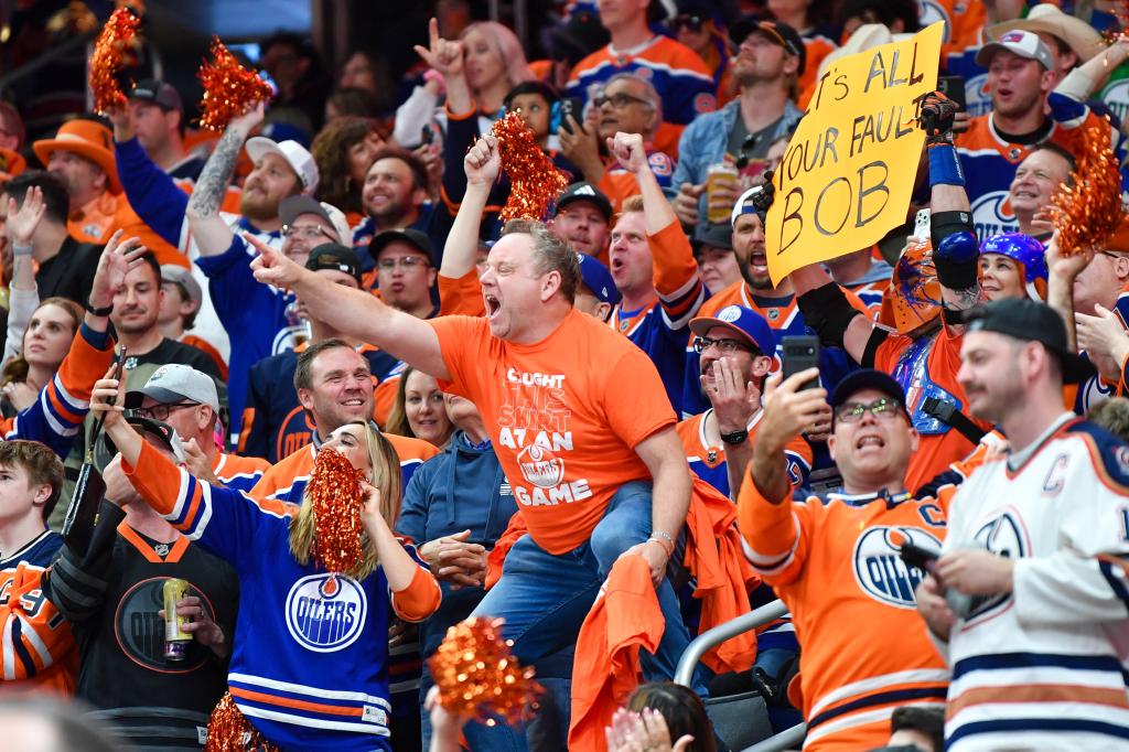Super-fan Cameron Hughes pumps up Oilers fans during their Game 6 win over the Panthers.