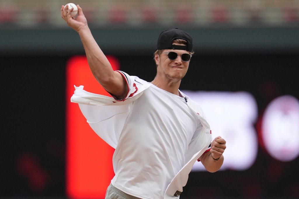 Minnesota Vikings first-round draft pick J.J. McCarthy throws out the first pitch before a baseball game between the Tampa Bay Rays and the Minnesota Twins, Tuesday, June 18, 2024, in Minneapolis.