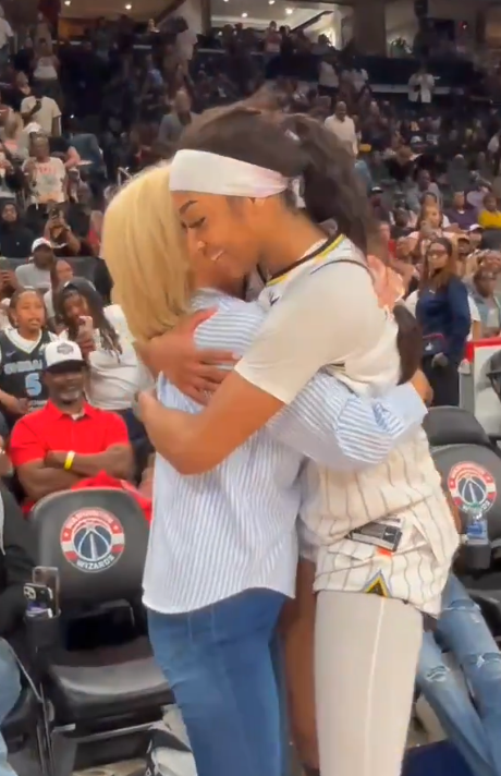 Reese and Mulkey share a hug.