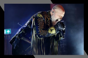 Judas Priest frontman Rob Halford scream-sings into the mic.