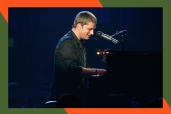 Matchbox Twenty frontman Rob Thomas smiles while playing piano.