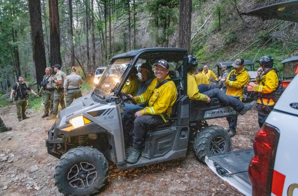 Rescue crew members relaxed after the hiker was found safely.